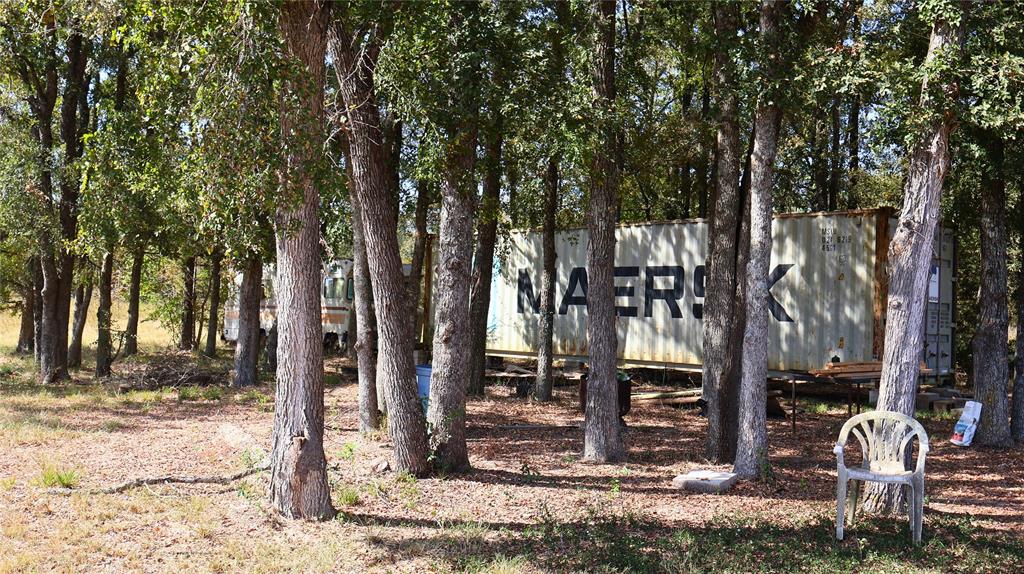 0 Private Road 8608 Tennessee Colony, TX 75861 - Photo 7 of 10 a front view of a house with garden