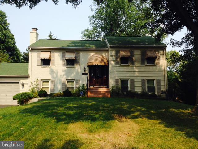 17309 Hughes Road Poolesville, MD 20837 - Photo 1 of 1 a front view of a house with a garden