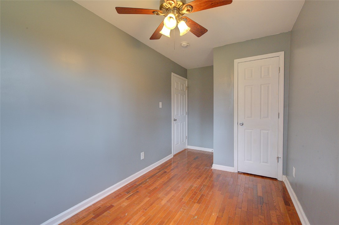 325 Rock Quarry Road Travelers Rest, SC 29690 - Photo 26 of 37 This airy bedroom features gleaming hardwood floors and ample natural light, perfect for a serene retreat.