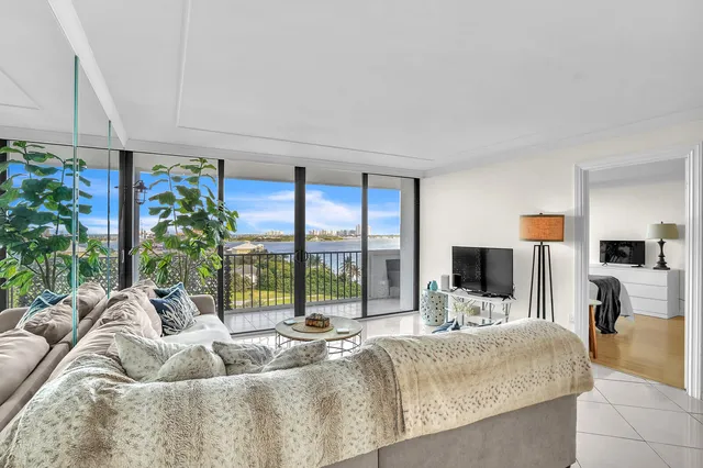 a living room with furniture fireplace and flat screen tv