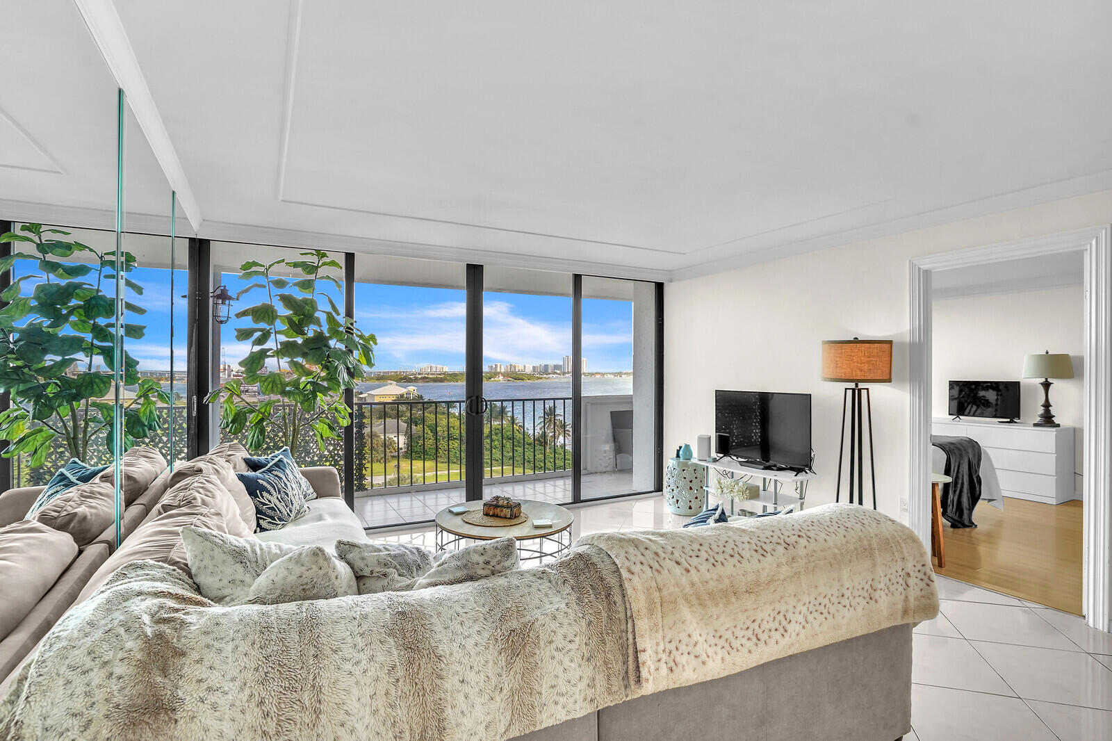 5600 North Flagler Drive, Unit 907 West Palm Beach, FL 33407 - Photo 11 of 48 a living room with furniture fireplace and flat screen tv