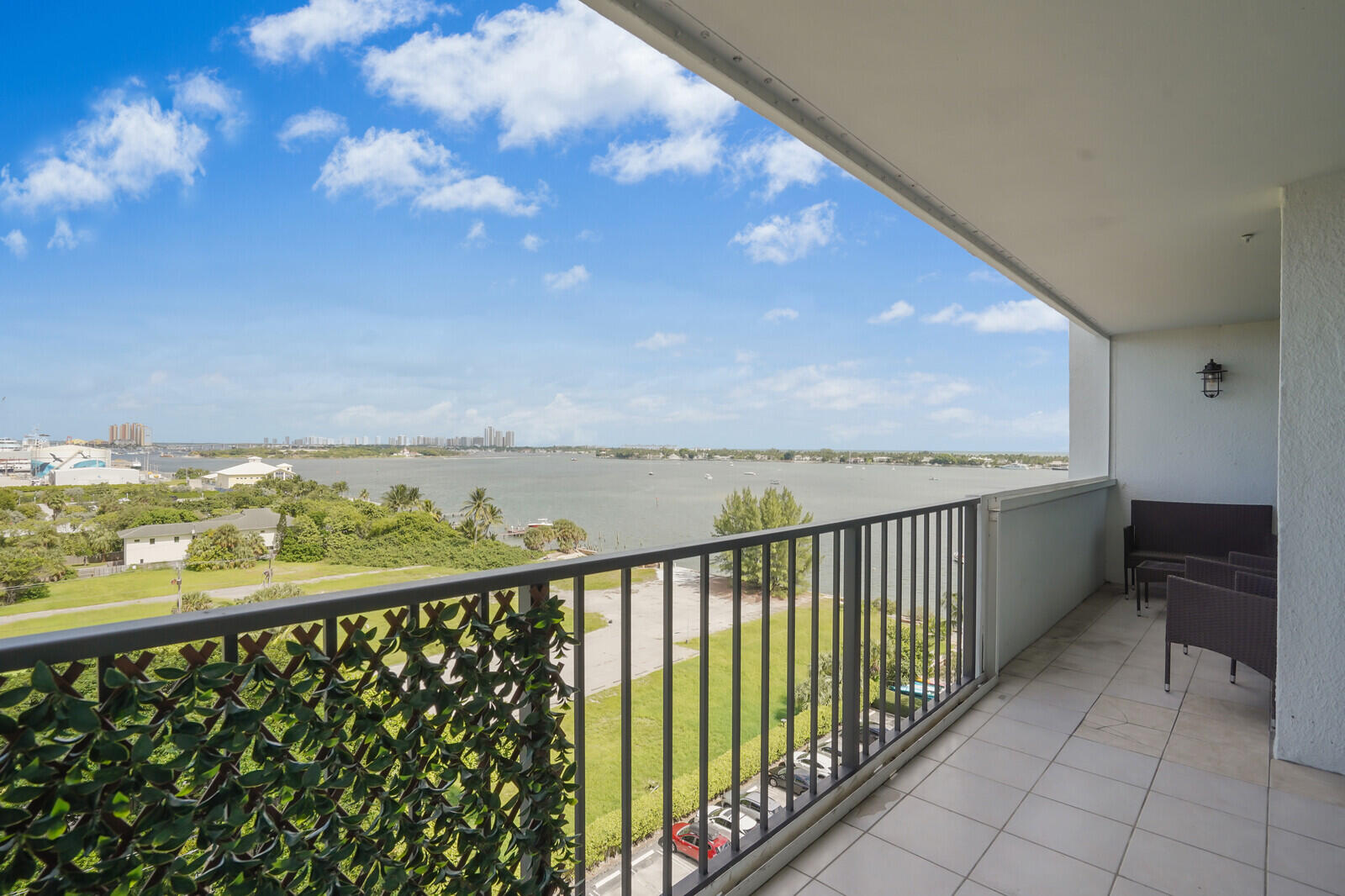 5600 North Flagler Drive, Unit 907 West Palm Beach, FL 33407 - Photo 17 of 48 a view of city and mountain from a balcony