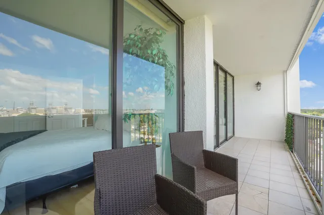 a view of a swimming pool with a lounge chairs