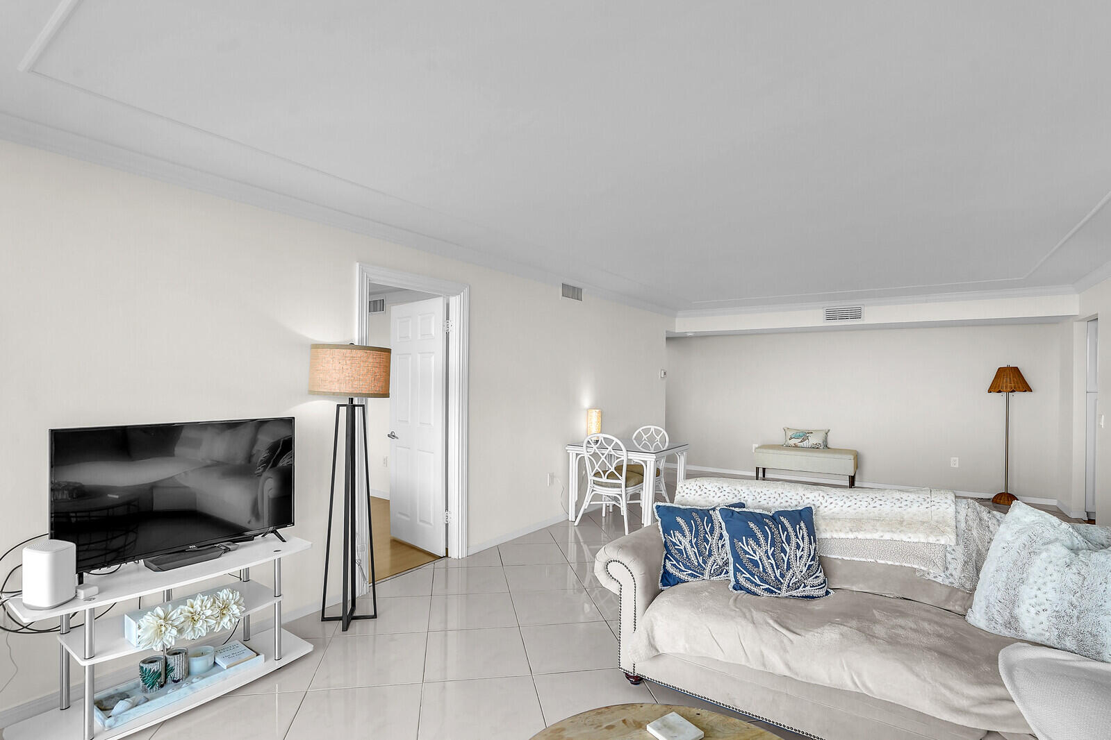 5600 North Flagler Drive, Unit 907 West Palm Beach, FL 33407 - Photo 27 of 48 a living room with furniture and a flat screen tv