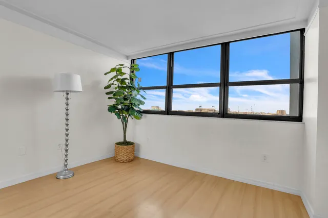 a bathroom with a sink mirror vanity and toilet