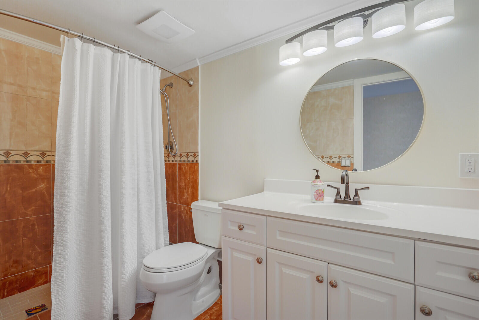 5600 North Flagler Drive, Unit 907 West Palm Beach, FL 33407 - Photo 29 of 48 a bathroom with a sink mirror vanity and toilet