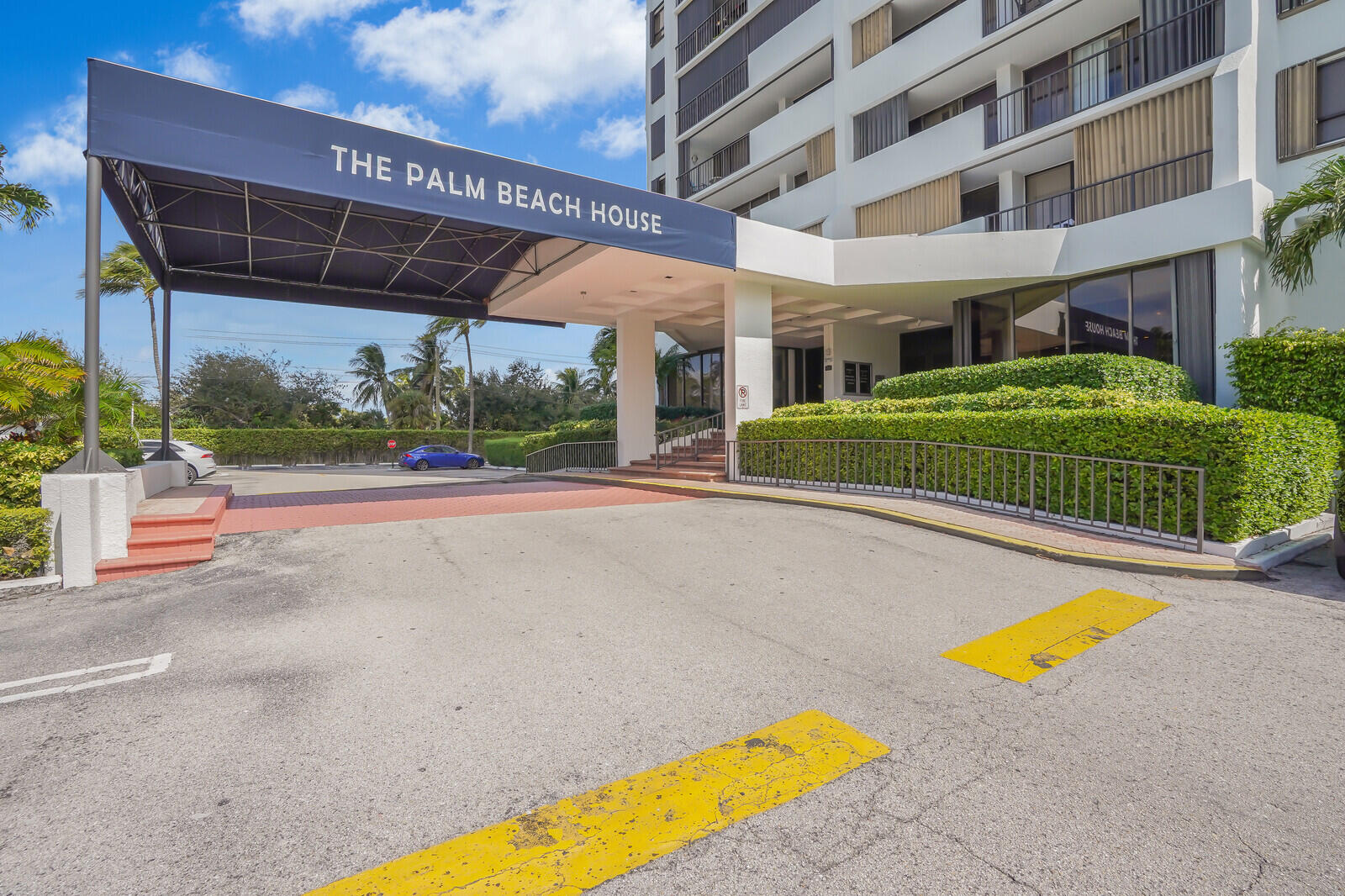 5600 North Flagler Drive, Unit 907 West Palm Beach, FL 33407 - Photo 7 of 48 a view of a swimming pool with a lounge chairs