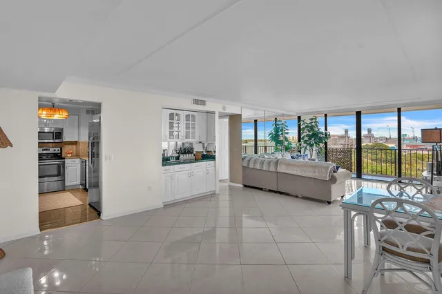 a view of a living room and a balcony