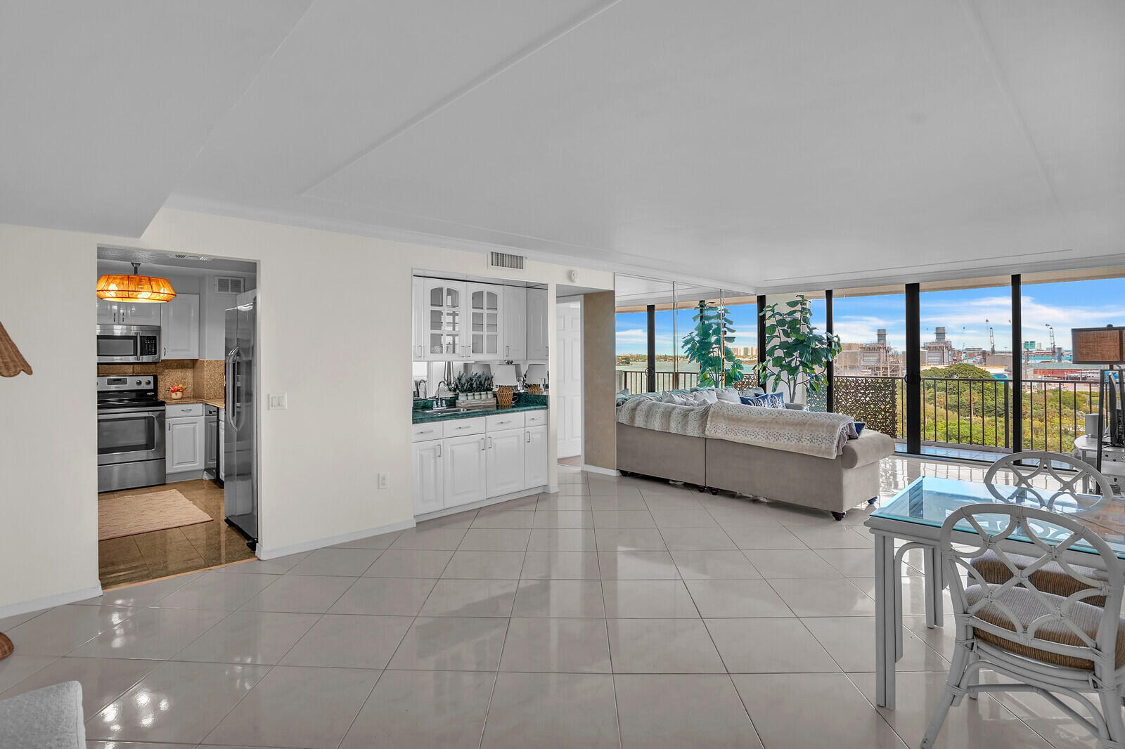 5600 North Flagler Drive, Unit 907 West Palm Beach, FL 33407 - Photo 8 of 48 a view of a living room and a balcony