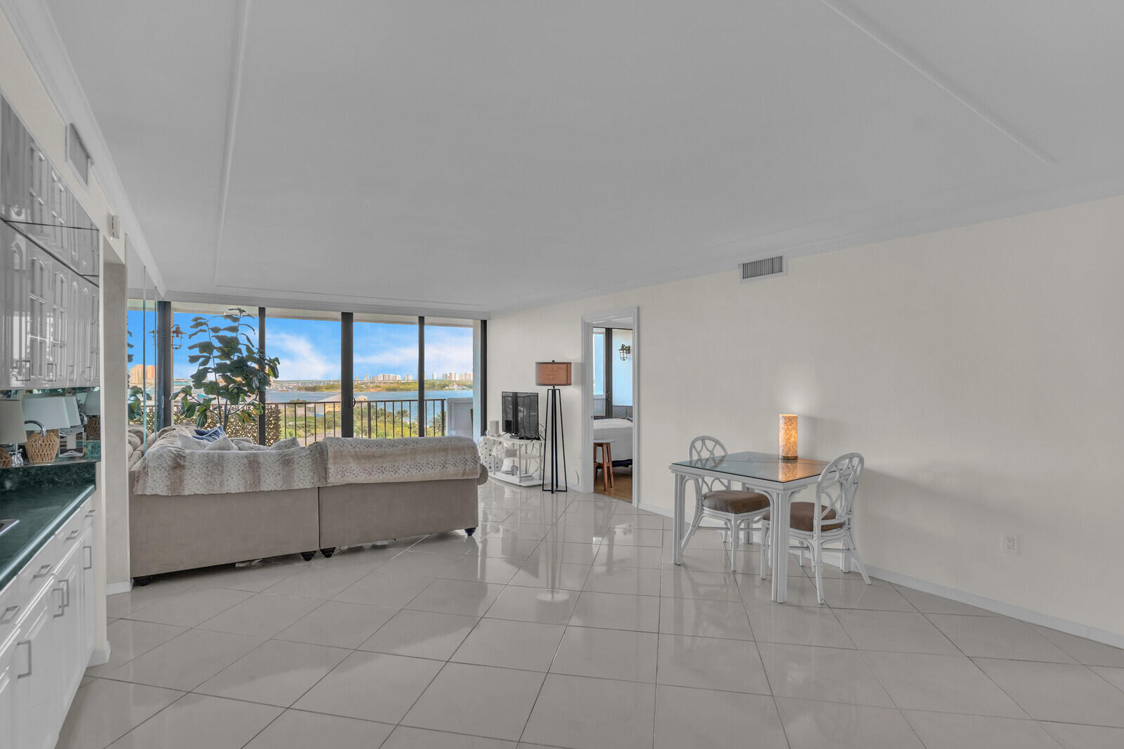 5600 North Flagler Drive, Unit 907 West Palm Beach, FL 33407 - Photo 9 of 48 a living room with furniture and a large window