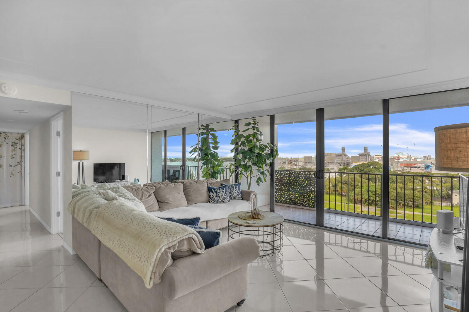 5600 North Flagler Drive, Unit 907 West Palm Beach, FL 33407 - Photo 10 of 48 a living room with furniture and a flat screen tv