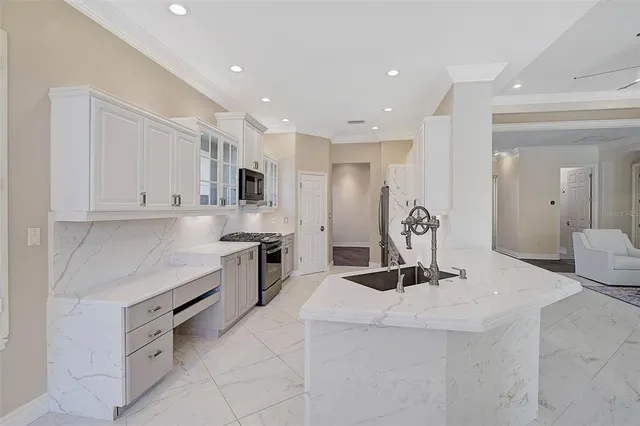 a kitchen with a stove a sink and a refrigerator