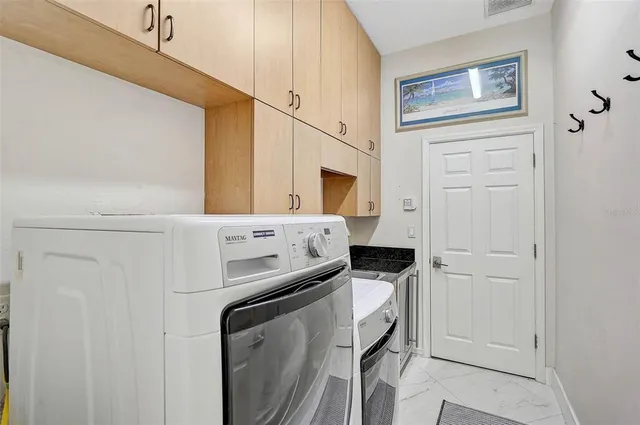 a swimming pool with yard in front of it