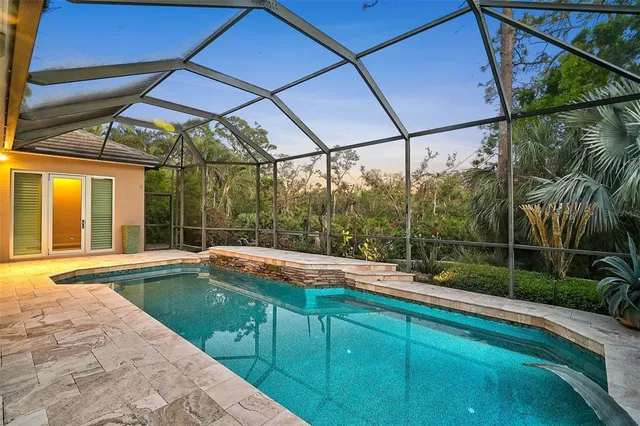 a view of a street with a houses in the background