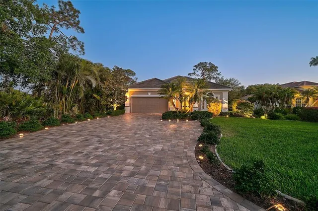 a living room with fireplace furniture a rug and a chandelier