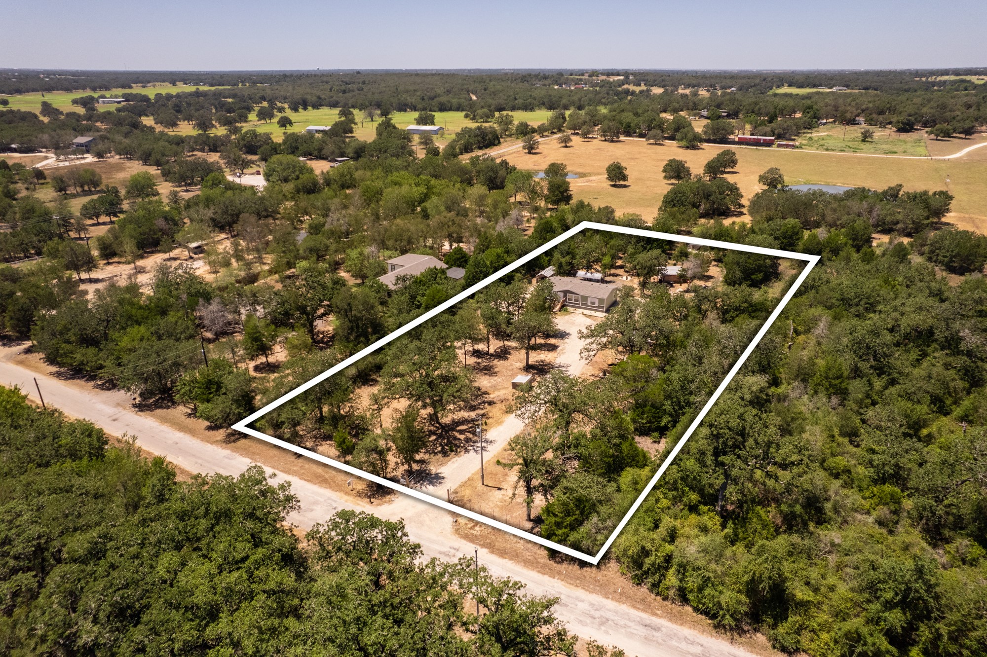 1039 Trailside Elgin, TX 78621 - Photo 20 of 24 Mature trees surround this peaceful country property outlined by spacious acreage.