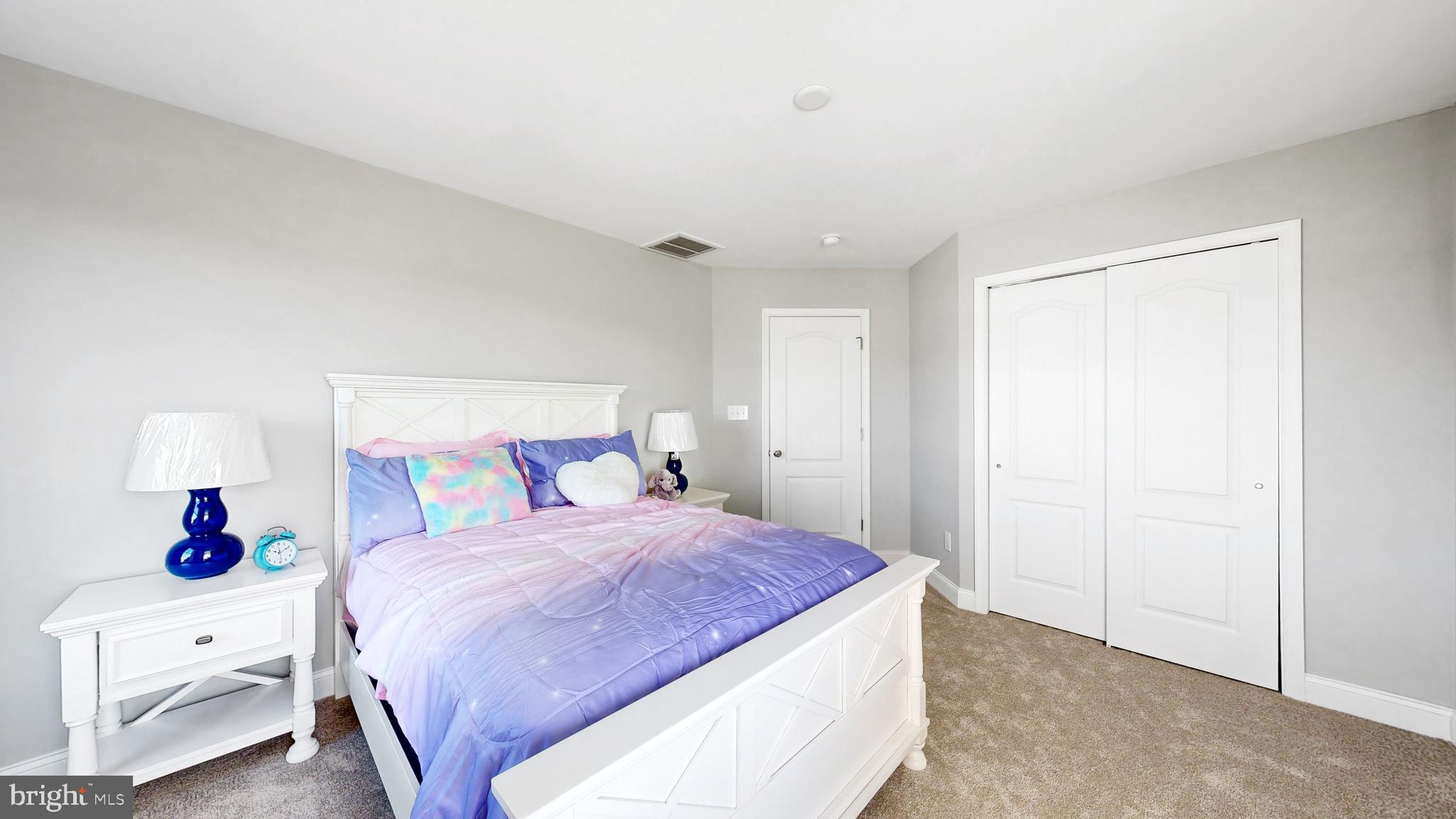 2 William Street Georgetown, DE 19947 - Photo 32 of 54 a spacious bedroom with a bed and a closet