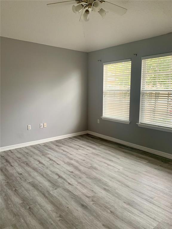 7131 Harmony Square Drive South, Unit 3 Harmony, FL 34773 - Photo 13 of 16 an empty room with a window