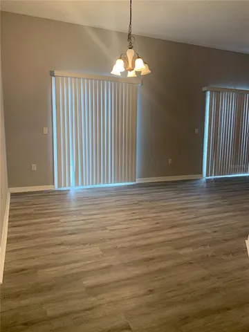 a view of a livingroom with wooden floor