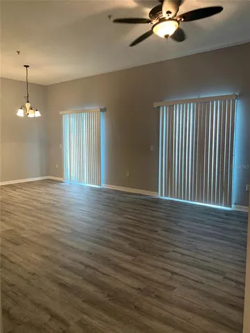 a view of a room with wooden floor