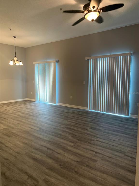 7131 Harmony Square Drive South, Unit 3 Harmony, FL 34773 - Photo 4 of 16 a view of a room with wooden floor