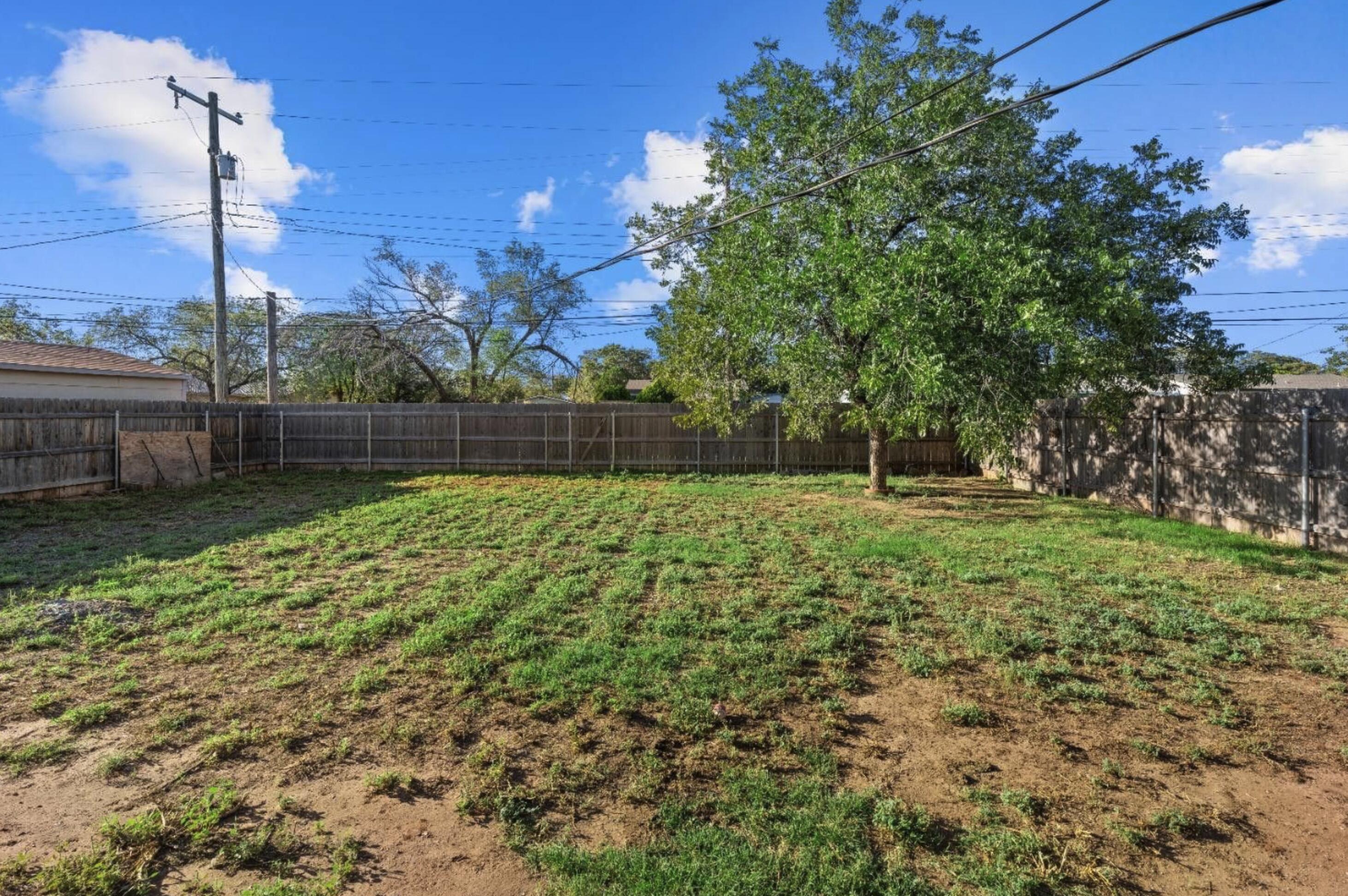 5105 38th Street Lubbock, TX 79414 - Photo 11 of 13 a view of pool with a yard