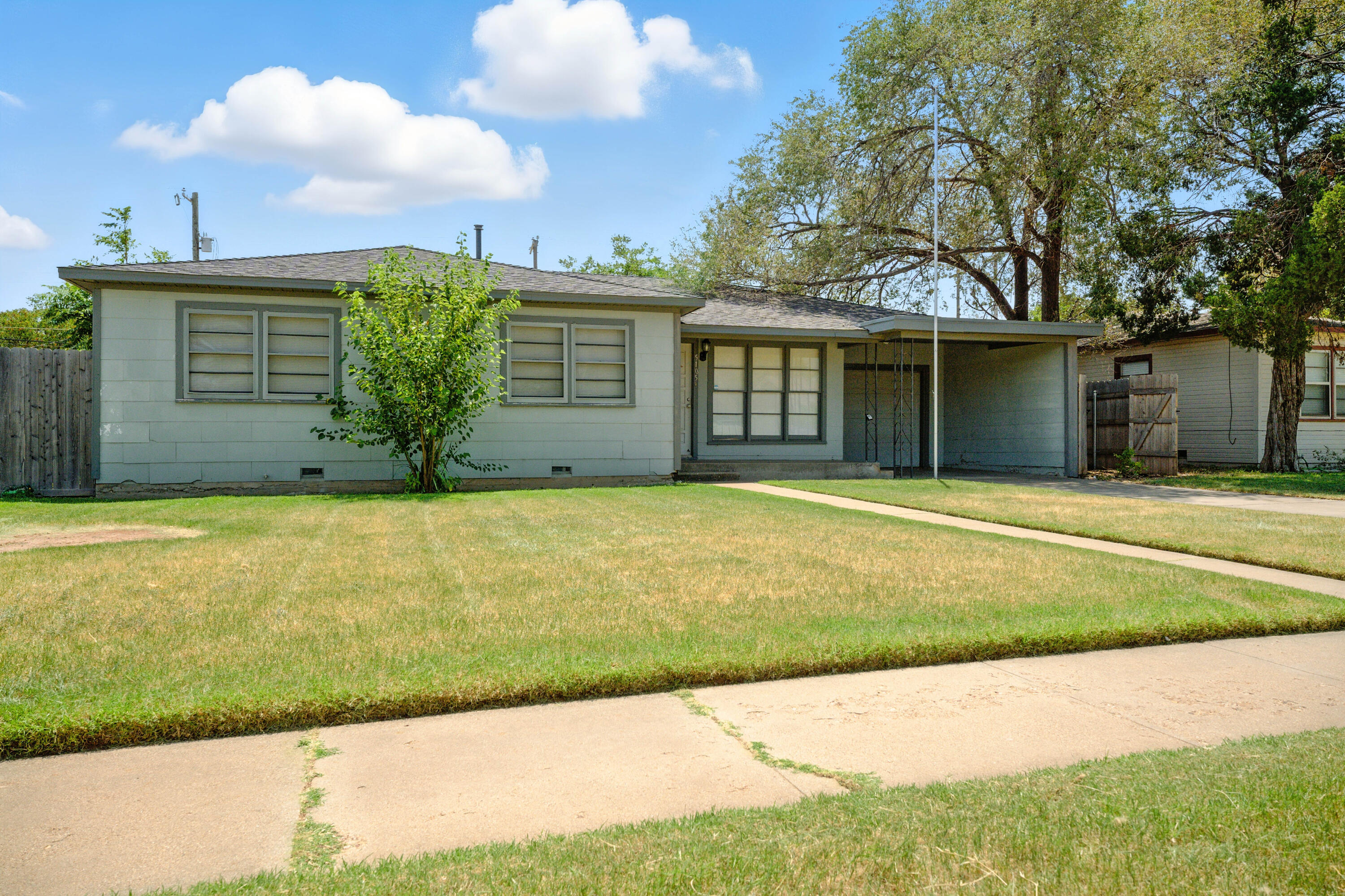 5105 38th Street Lubbock, TX 79414 - Photo 13 of 13 a front view of a house with garden