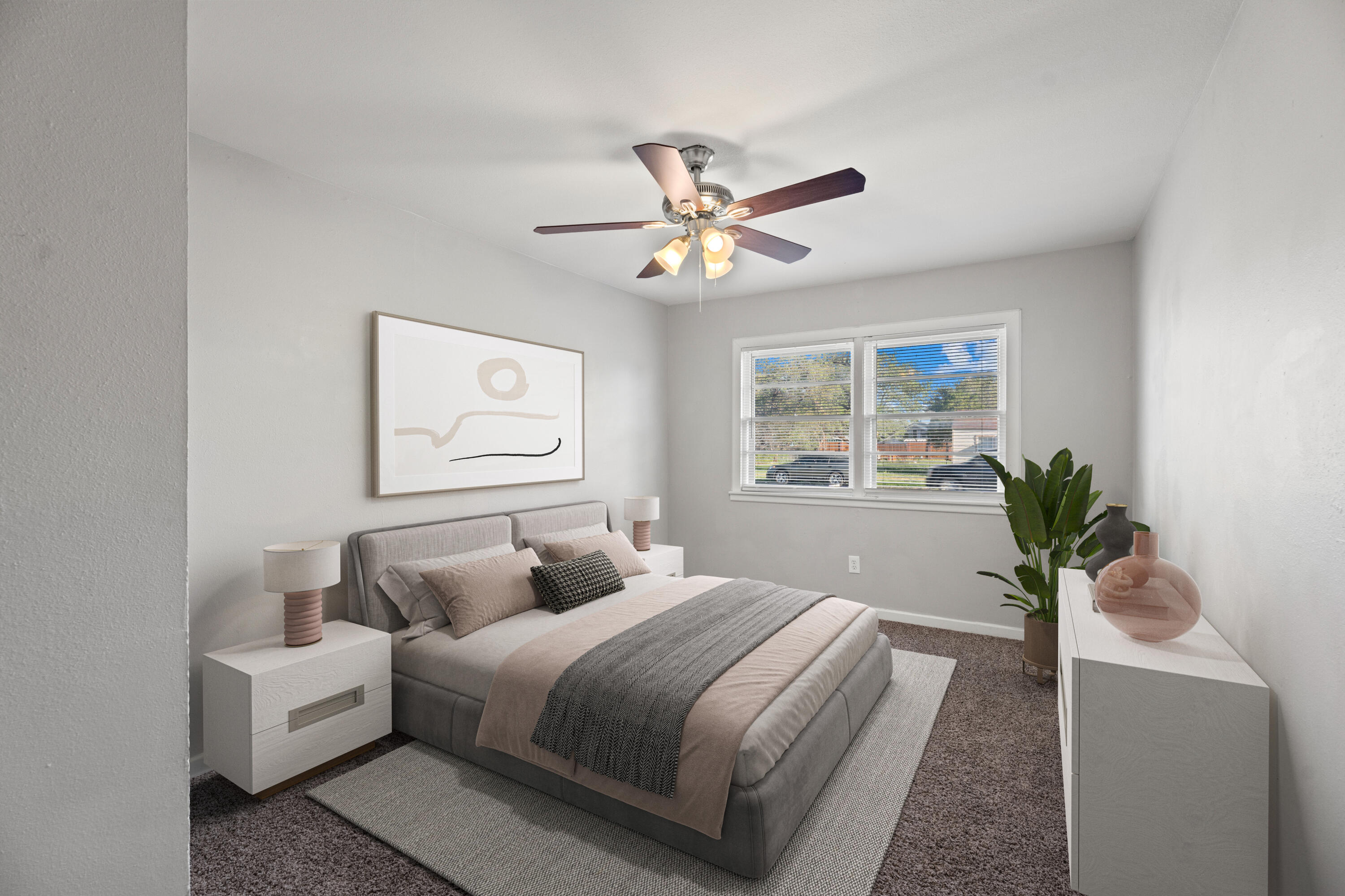 5105 38th Street Lubbock, TX 79414 - Photo 9 of 13 a bedroom with a large bed and a window