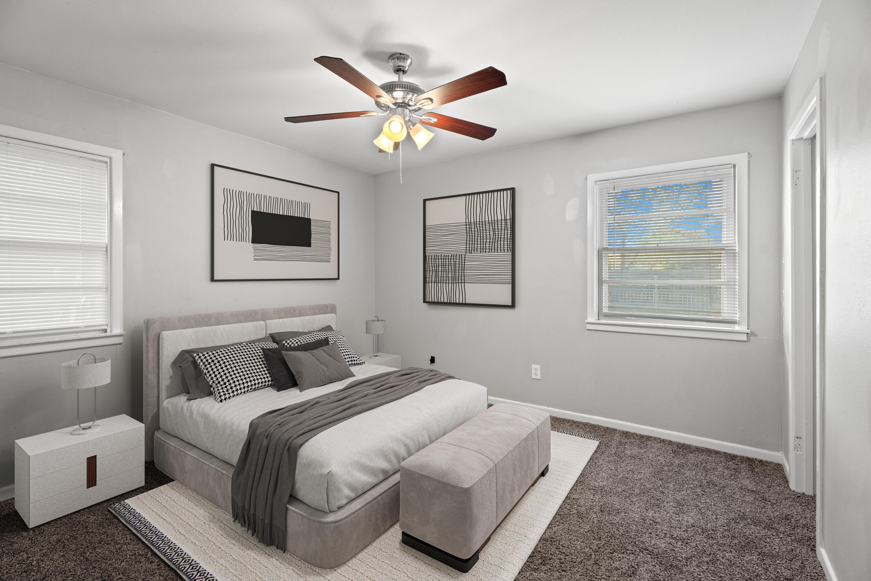 5105 38th Street Lubbock, TX 79414 - Photo 10 of 13 a bedroom with a large bed and a window