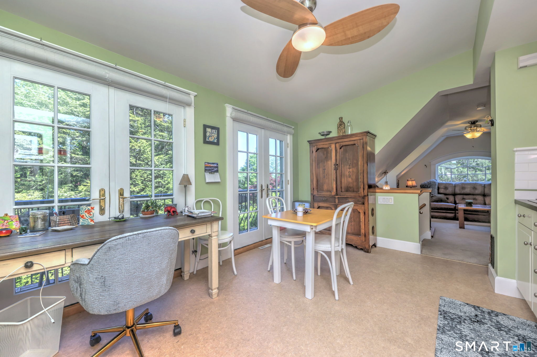 25 Center Road Woodbridge, CT 06525 - Photo 27 of 34 a dining room with wooden floor and large windows