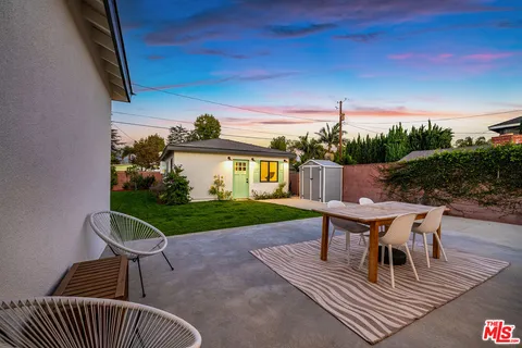 a view of a table and chairs in patio