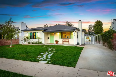 a view of a house with a back yard