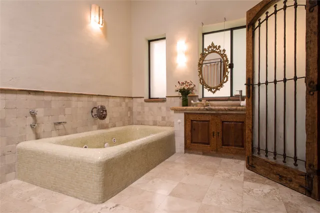 a living room with furniture and painting on the wall