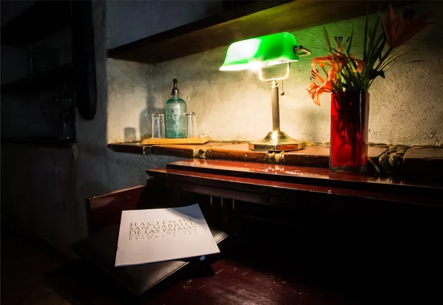 a view of a swimming pool with outdoor seating