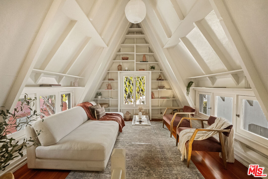 237 Mabery Road Santa Monica, CA 90402 - Photo 16 of 43 a living room with furniture a fireplace and a large window