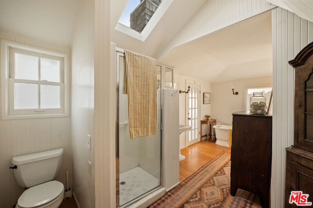 237 Mabery Road Santa Monica, CA 90402 - Photo 24 of 43 a bathroom with a granite countertop bathtub shower sink mirror and toilet