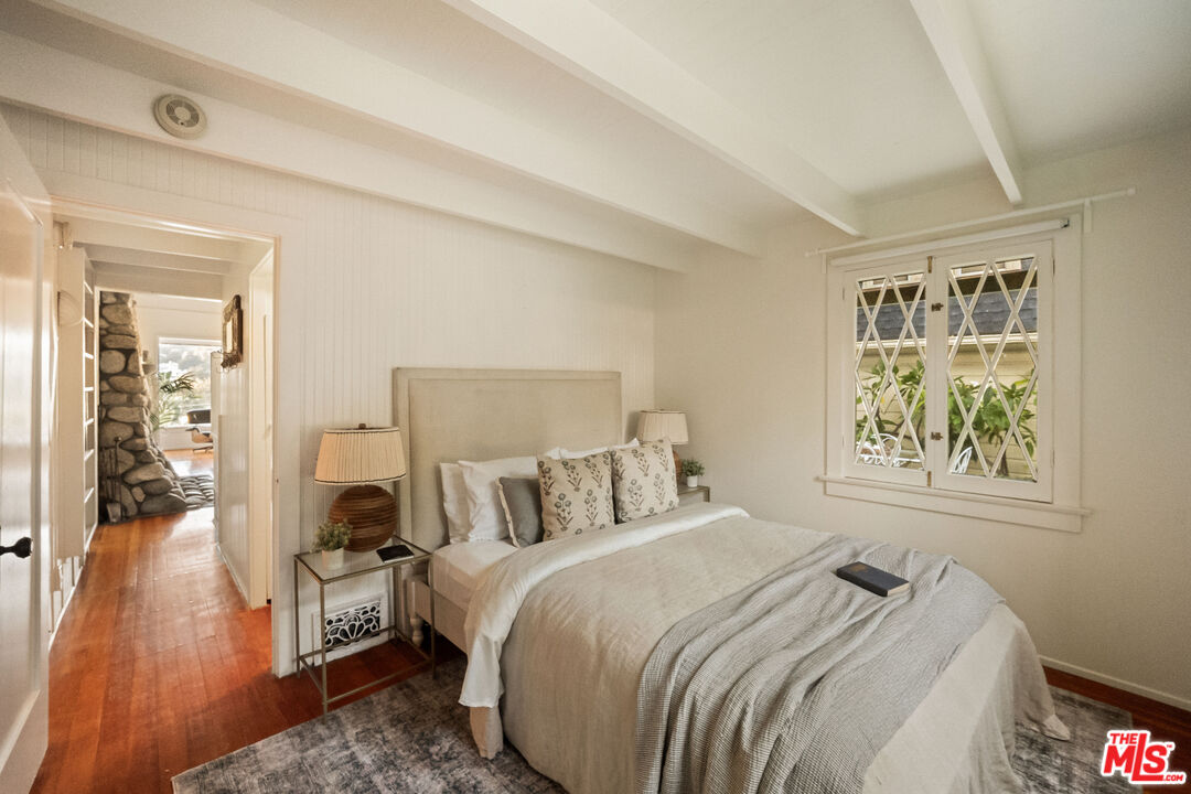 237 Mabery Road Santa Monica, CA 90402 - Photo 28 of 43 a bedroom with a bed and wooden floor