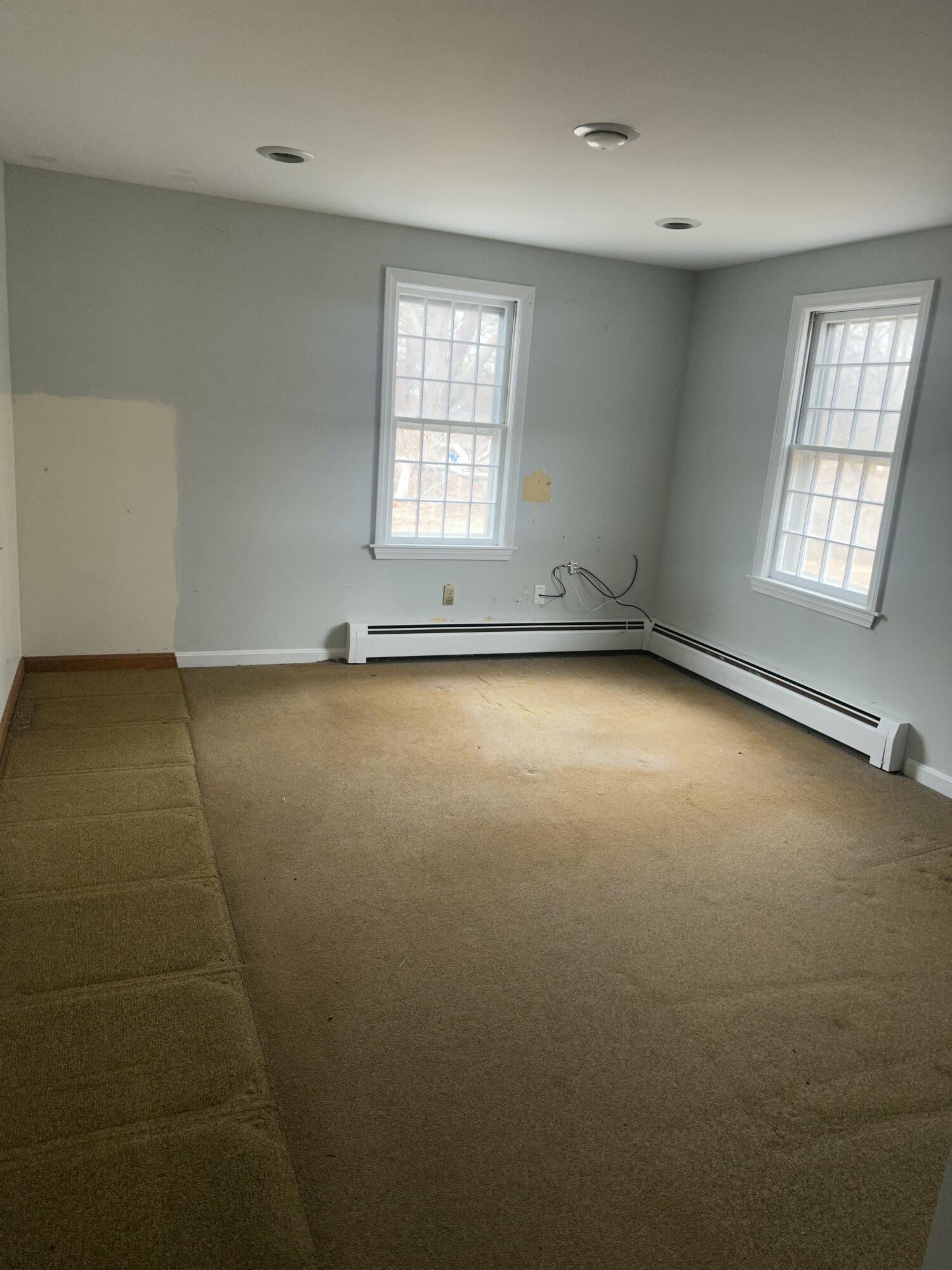 33 Old Colony Road Harwich, MA 02645 - Photo 11 of 16 an empty room with windows