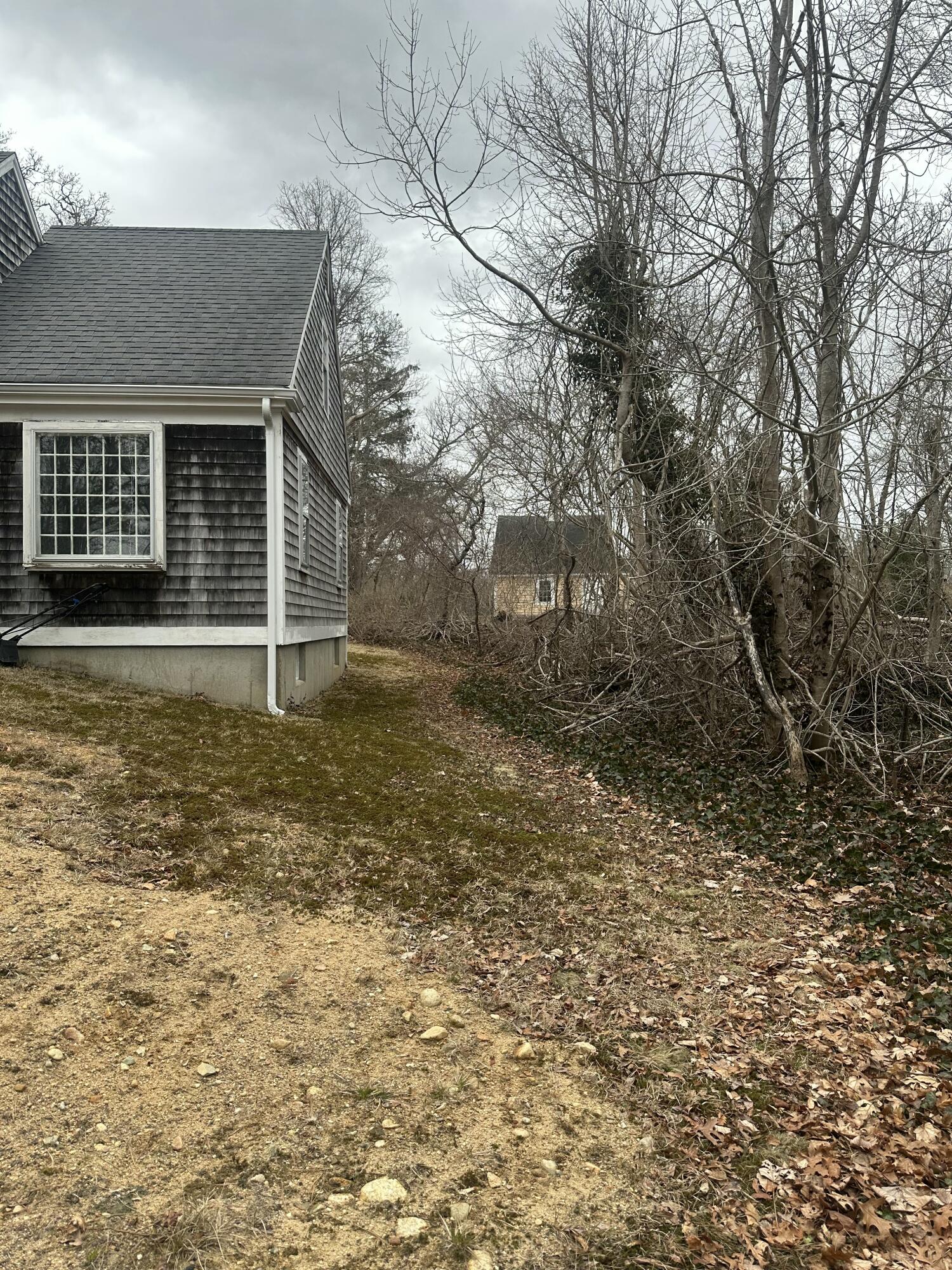 33 Old Colony Road Harwich, MA 02645 - Photo 6 of 16 front view of house with a yard