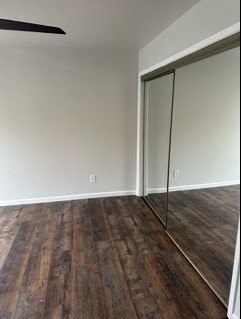 4520 Speedway, Unit A Austin, TX 78751 - Photo 3 of 6 Rich wood plank flooring sets a warm tone in this versatile bedroom space.