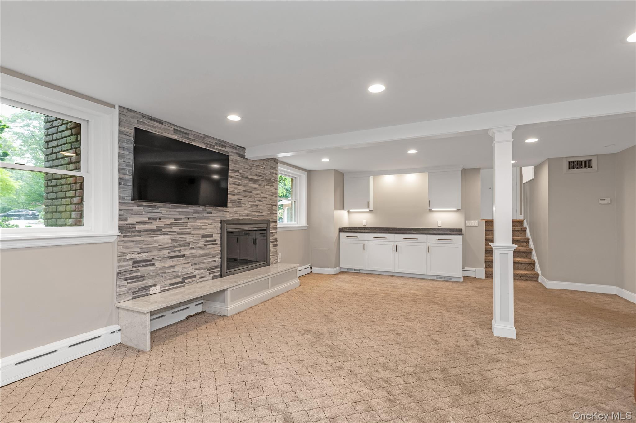 11 Quaker Ridge Road Glen Head, NY 11545 - Photo 21 of 32 Lower level den with fireplace