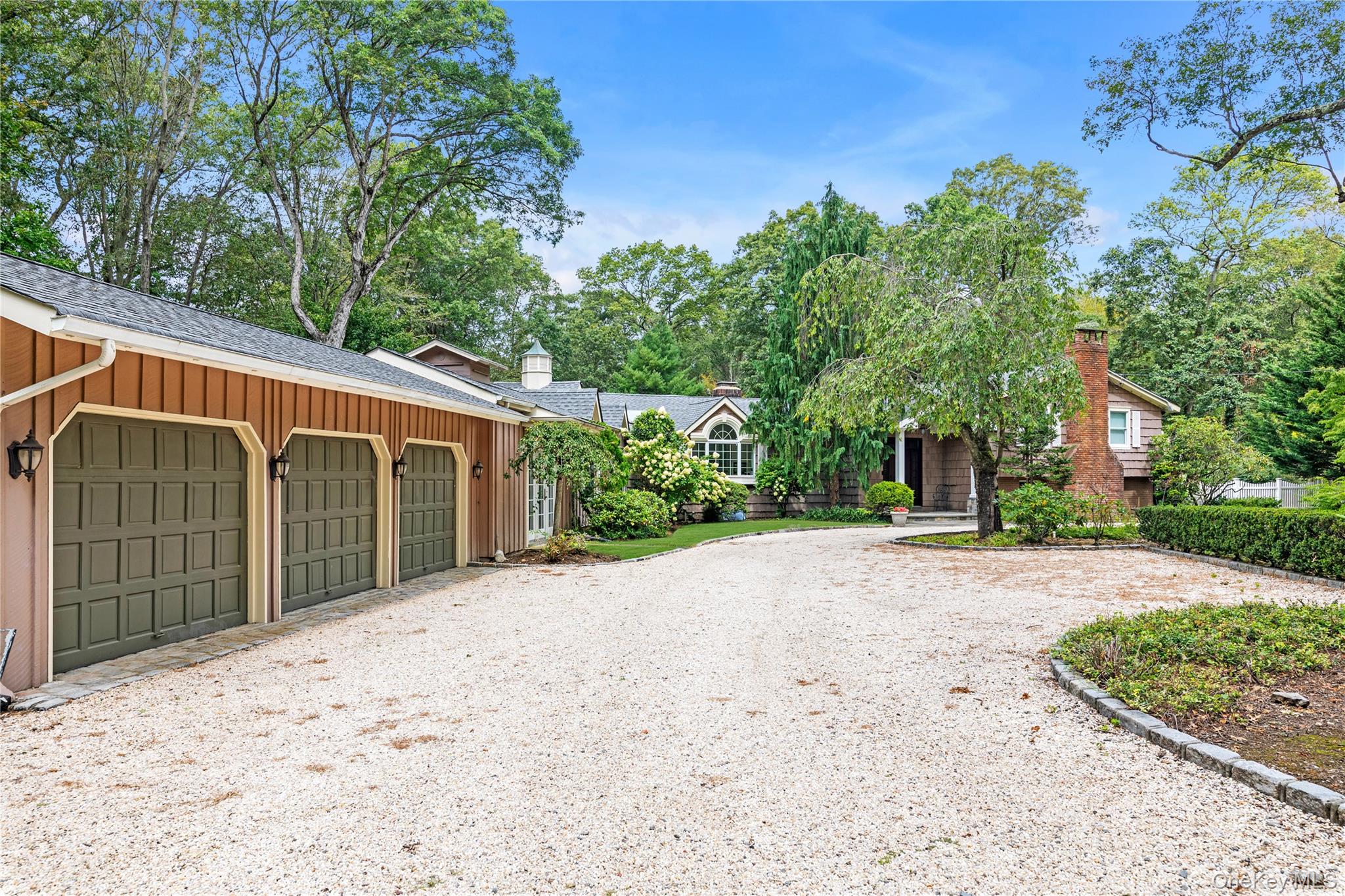 11 Quaker Ridge Road Glen Head, NY 11545 - Photo 28 of 32 Three car garage and ample courtyard parking