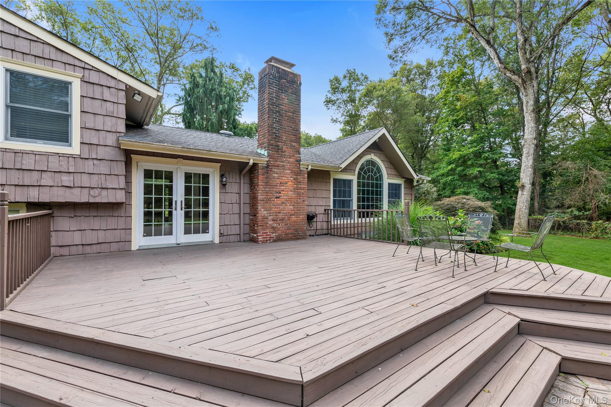 11 Quaker Ridge Road Glen Head, NY 11545 - Photo 10 of 32 Wooden terrace with french doors