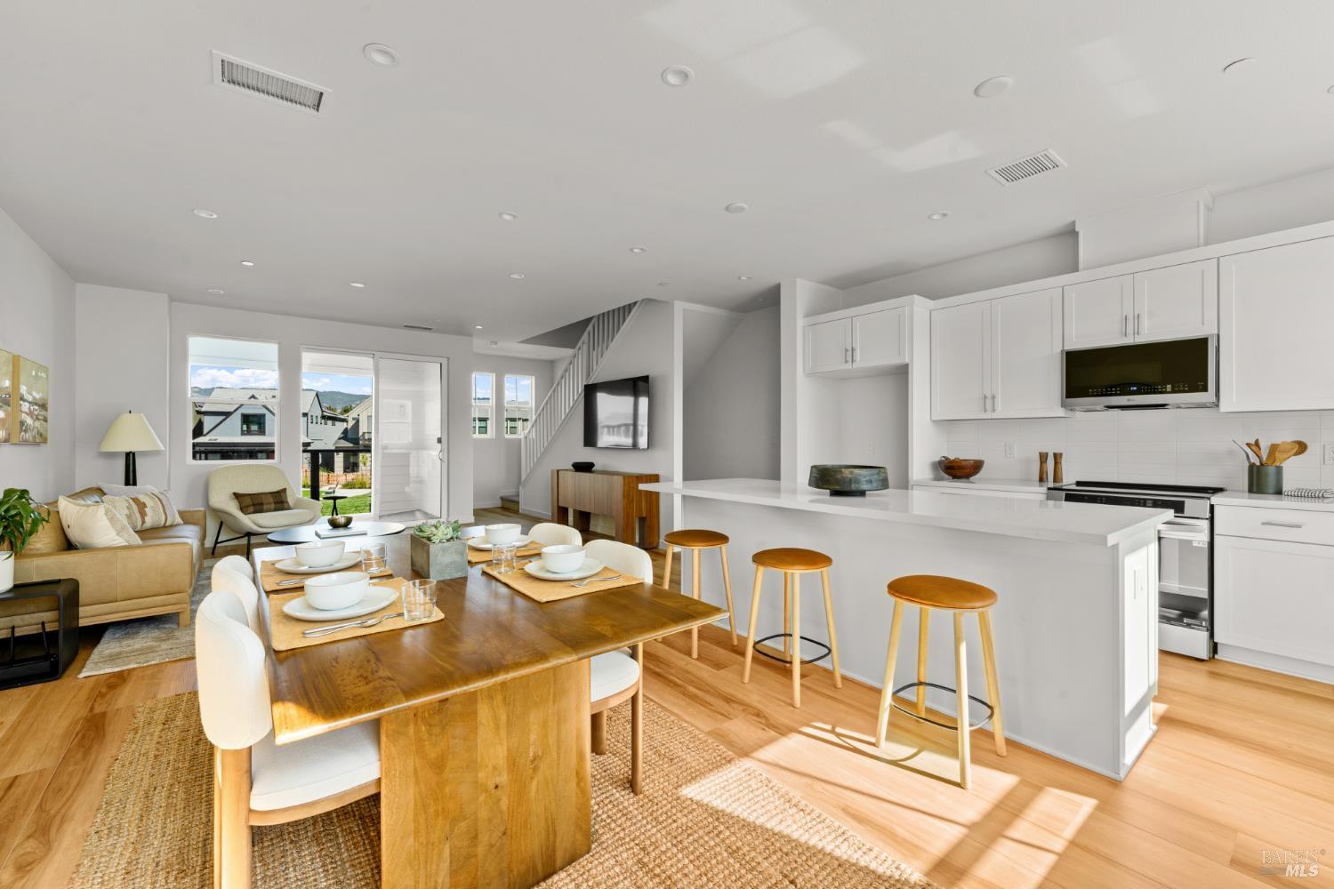 1460 Waterside Lane Rohnert Park, CA 94928 - Photo 2 of 21 a dining room with stainless steel appliances kitchen island granite countertop a dining table chairs and view kitchen