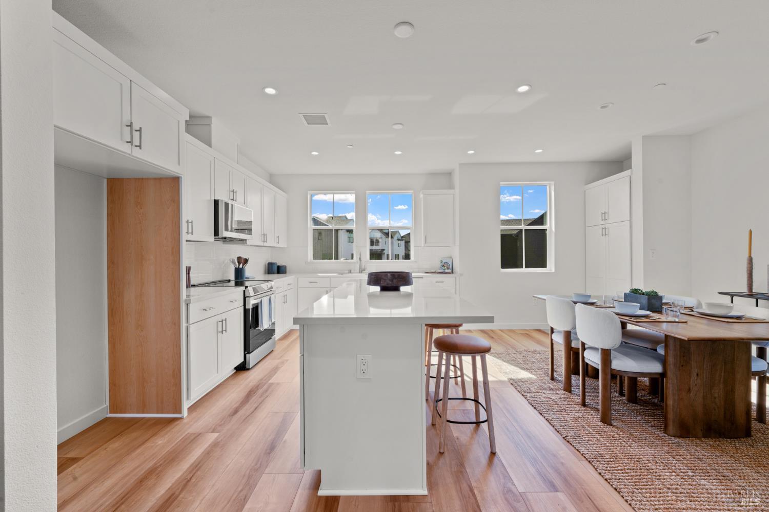 1460 Waterside Lane Rohnert Park, CA 94928 - Photo 4 of 21 a living room with stainless steel appliances kitchen island granite countertop furniture and wooden floor