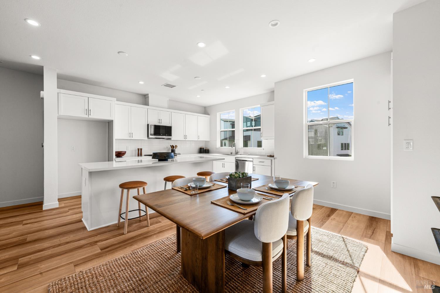 1460 Waterside Lane Rohnert Park, CA 94928 - Photo 5 of 21 a kitchen with a dining table chairs and refrigerator