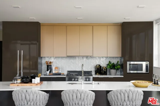 a kitchen with a table and chairs