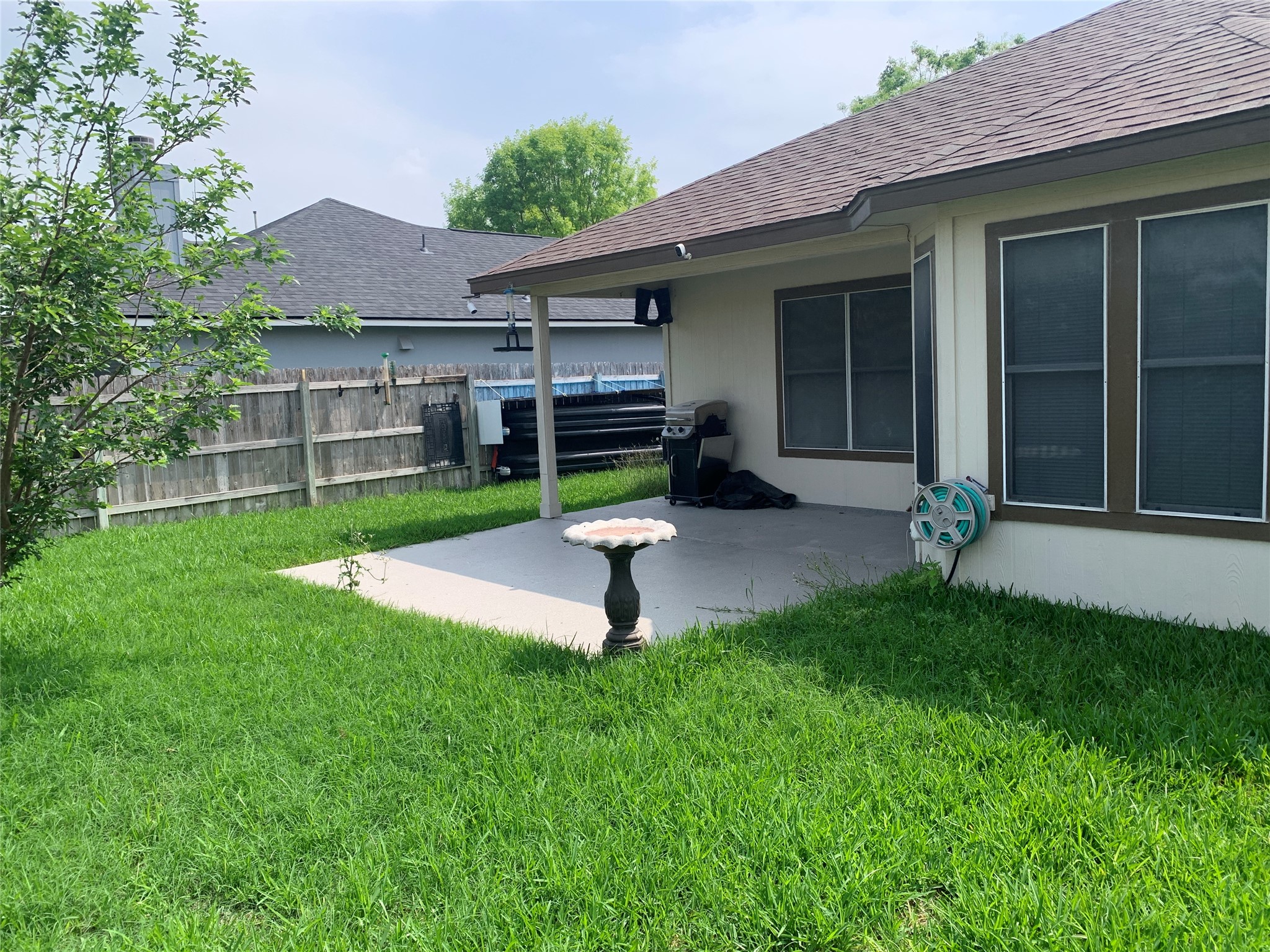 150 Elmer Cove Kyle, TX 78640 - Photo 11 of 11 a house with a garden in front of it