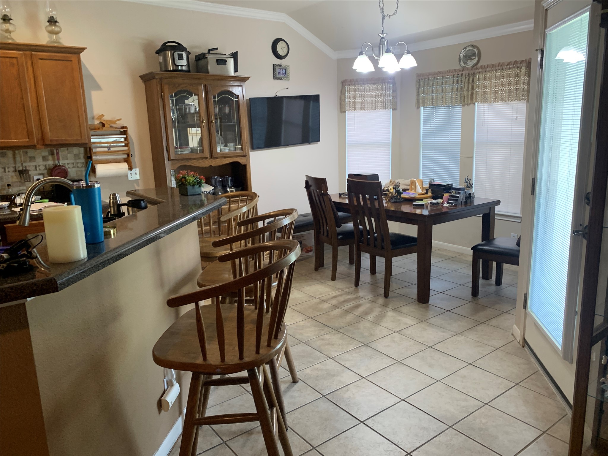 150 Elmer Cove Kyle, TX 78640 - Photo 3 of 11 a view of a dining room with furniture and a chandelier