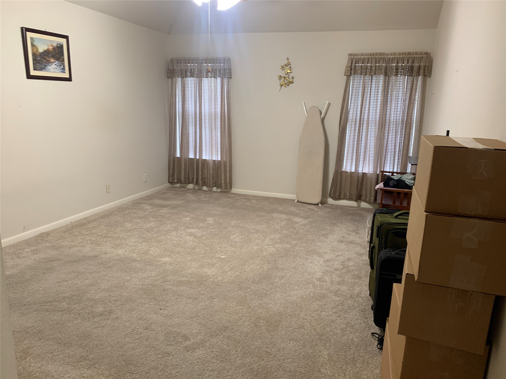 150 Elmer Cove Kyle, TX 78640 - Photo 6 of 11 an empty room with windows